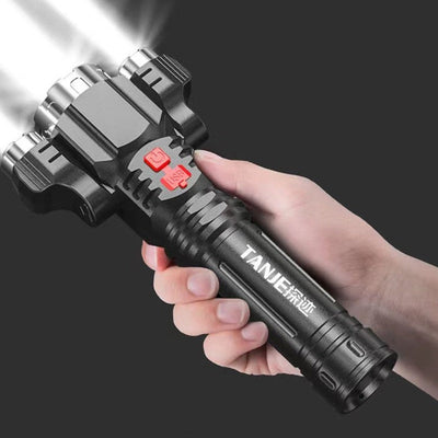 Outdoor home portable riding USB rechargeable flashlight held in hand.